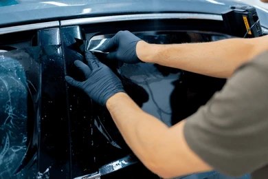 Expert installation of car tint ensuring precision